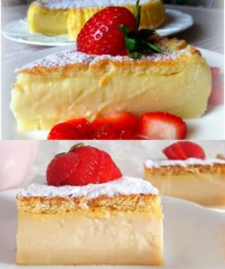 A creamy slice of white chocolate magic cake topped with powdered sugar and fresh strawberries.