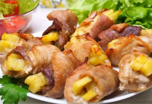 Crispy pork and potato rolls baked golden, served on a white plate