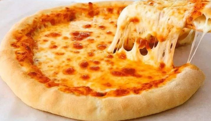 No-knead pizza dough recipe with melted mozzarella cheese pulling apart