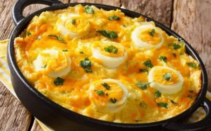 serving creamy egg gratin recipe on a plate with parsley