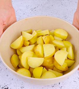 boiled potatoes in a bowl ready for potato and tuna salad recipe