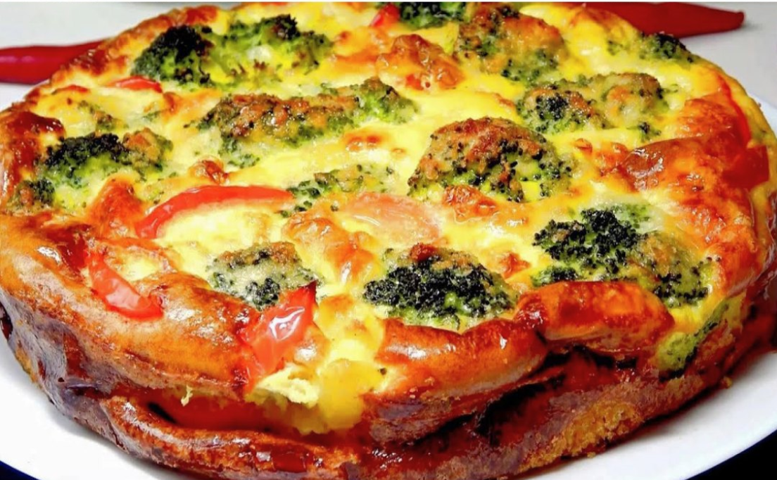 Golden baked vegetable flan with melted cheese on top, served warm for a healthy dinner