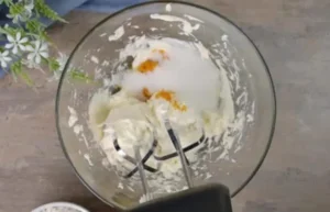 Tiramisu Heaven RecipeWhipping fresh cream until fluffy for Tiramisu Heaven dessert