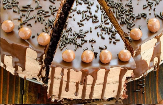 Moist and rich Homemade Chocolate Cake Recipe freshly baked and topped with creamy chocolate icing.