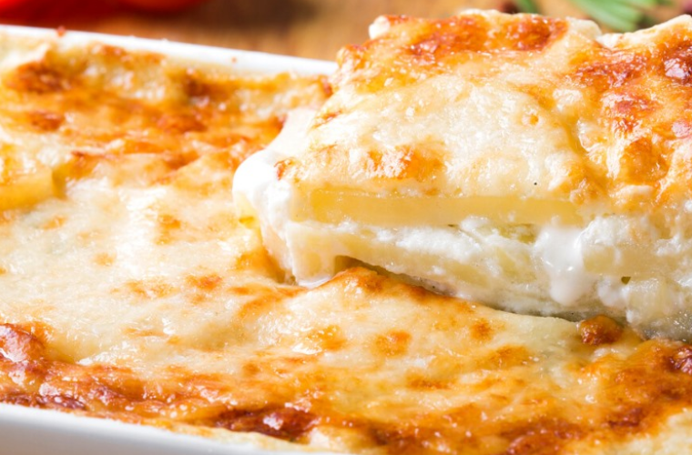 Golden-baked Potato and Bacon Pie fresh from the oven with melted provola cheese and crispy pancetta topping.