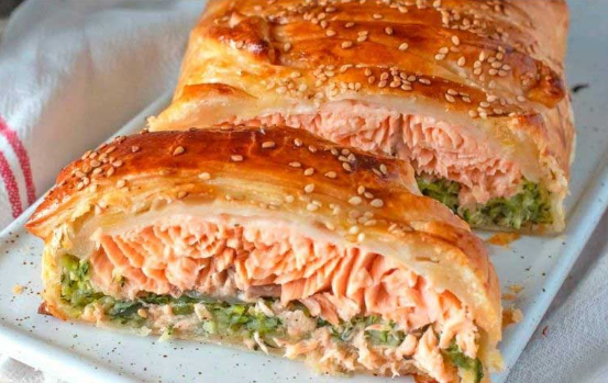 creamy salmon skillet recipe open showing flaky salmon and zucchini filling