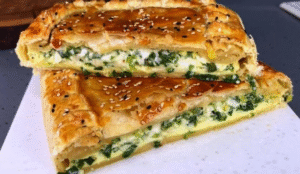 sliced shallot and egg tart served on a presentation plate