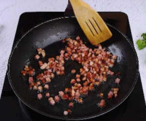 potato gratin recipe cooking onions and bacon in a pan