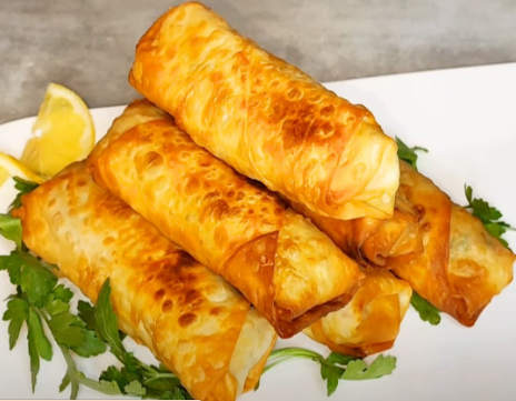 Golden filled phyllo rolls with tuna, mozzarella, and olives