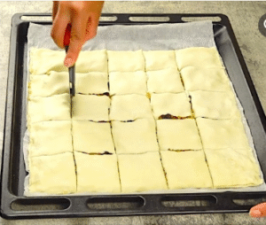 Cutting puff pastry into small squares