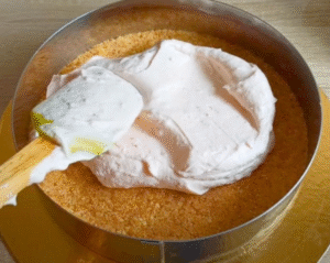 Mixing the strawberry cheesecake filling with mascarpone and cream.