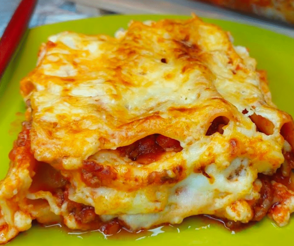 beef cannelloni recipe with golden melted cheese and ragù
