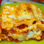 beef cannelloni recipe with golden melted cheese and ragù