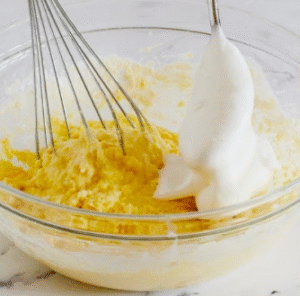 cream muffins recipe preparation: whipping egg whites to stiff peaks