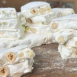 Homemade white nougat bars stacked and ready to serve.
