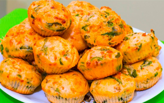 Golden savory zucchini muffins on a plate