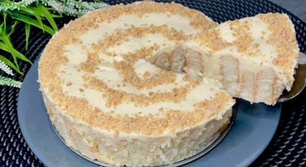 The best lemon cake in the world topped with whipped cream and lemon slices