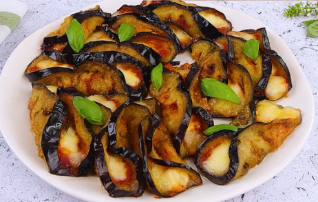 Pizzaiola-style eggplant rolls recipe baked to golden perfection with basil garnish