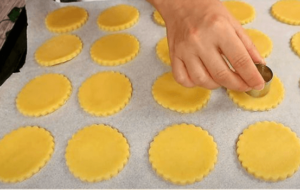 Cutting shortbread cookie dough into round shapes