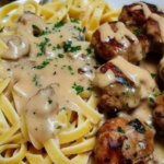 tagliatelle with mushroom sauce and meatballs served hot