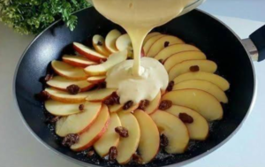 apple and lemon crepe recipe cooking in non stick pan before flipping