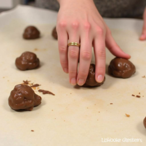 Rolling date mixture into truffles