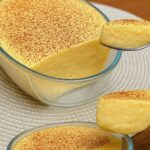 Creamy vanilla dessert cream served in glass bowls topped with cocoa powder