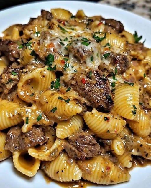 garlic butter steak bites with creamy parmesan pasta