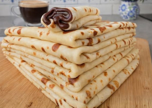 homemade crepe recipe stack of soft thin crepes with chocolate filling