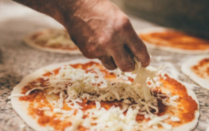 Pre-baked crust for high protein healthy pizza with tomato sauce