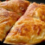 Golden baked cheesy beef tortilla slices with melted mozzarella