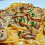 Creamy Mushroom Spaghetti Recipe with cheese sauce and parsley garnish