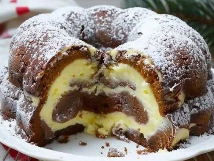 quick bundt cake recipe with cream cheese filling and powdered sugar