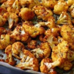 crispy baked cauliflower florets golden and roasted in oven