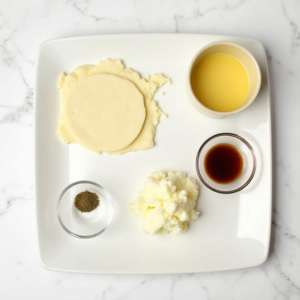 Ingredients for mozzarella stuffed crepes including ricotta and flour