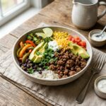 High Protein Ground Beef Recipes served with rice beans and vegetables