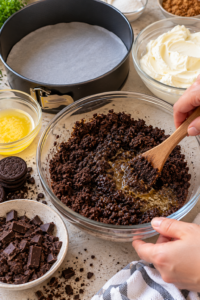 Chocolate cookie crust ingredients being prepared for no-bake chocolate mousse cake.