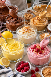 Chocolate, caramel, coconut, lemon, and raspberry Cool Whip Desserts being portioned