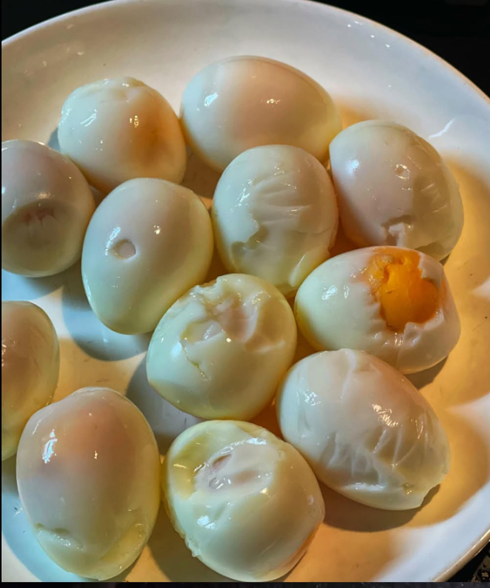Hard-boiled eggs with damaged whites after difficult peeling