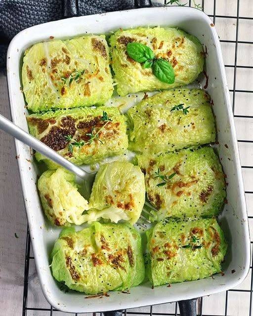 Cheesy Potato Stuffed Cabbage Rolls baked until golden