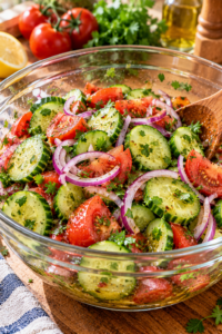 marinated cucumber salad with fresh cucumbers tomatoes onions and herbs