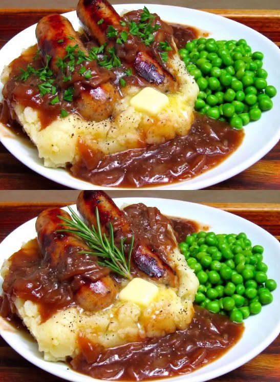 Bangers and mash with browned sausages, mashed potatoes, onion gravy, and green peas.