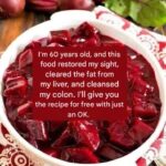 Bowl of cooked beetroot salad cut into glossy red cubes