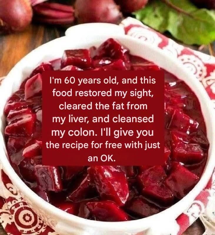 Bowl of cooked beetroot salad cut into glossy red cubes