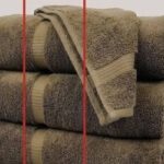 Lines on bath towels highlighted on a stack of folded towels