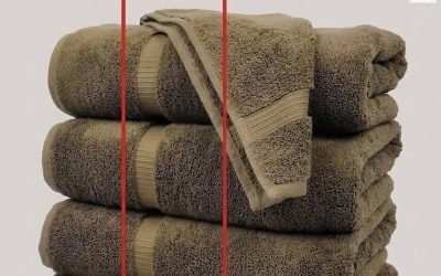 Lines on bath towels highlighted on a stack of folded towels