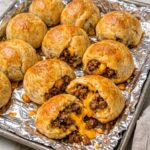 4-Ingredient Beef Crescent Puffs filled with seasoned ground beef and melted cheddar cheese