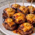 3-Ingredient Cheddar Bratwurst Bites with melted cheddar and golden bratwurst