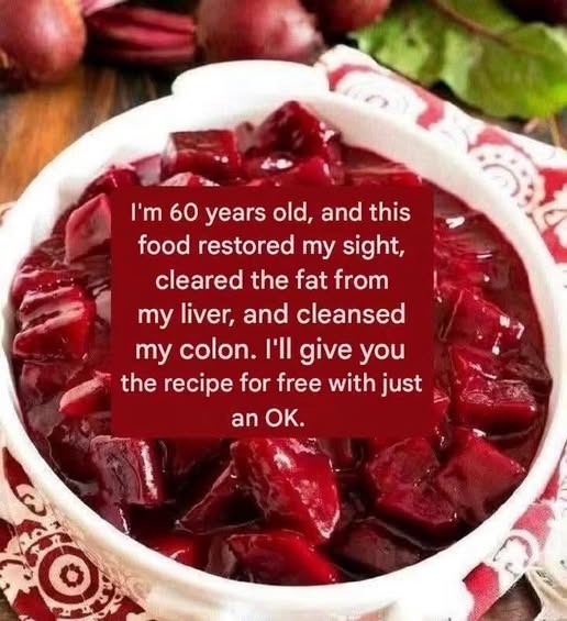 Bowl of cooked beetroot salad cut into glossy red cubes