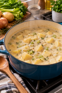 Creamy Potato Soup gently simmering with tender potato chunks